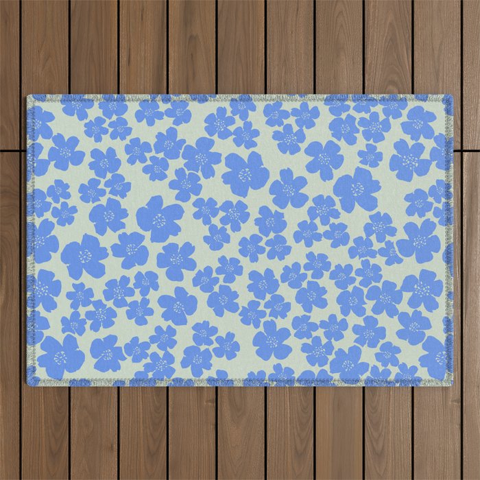 Blue flower blossom scatter on soft green Outdoor Rug Gallery Image 1