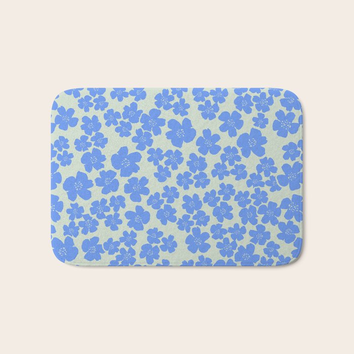 Blue flower blossom scatter on soft green Bath Mat Gallery Image 1