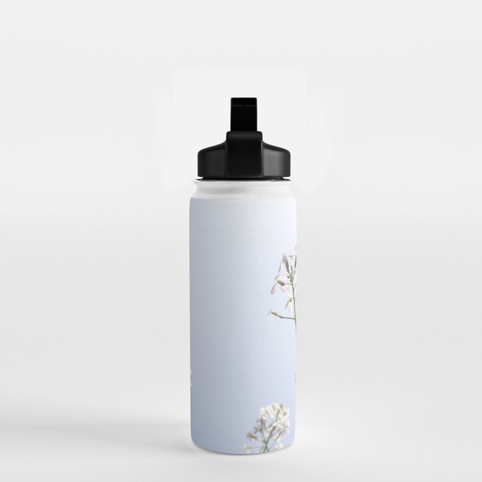Wild radish flowers in a meadow in the spring against a clear blue sky - nature photography Water Bottle Gallery Image 2