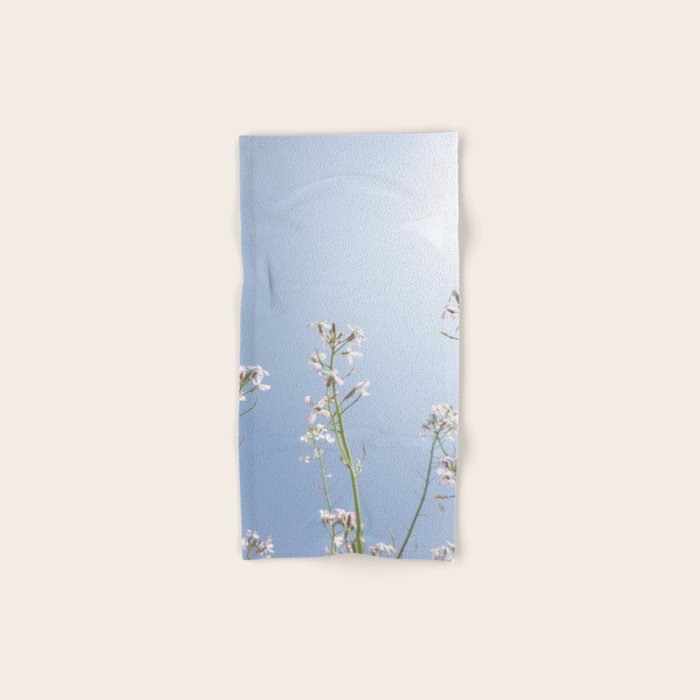 Wild radish flowers in a meadow in the spring against a clear blue sky - nature photography Bath Towel Gallery Image 1