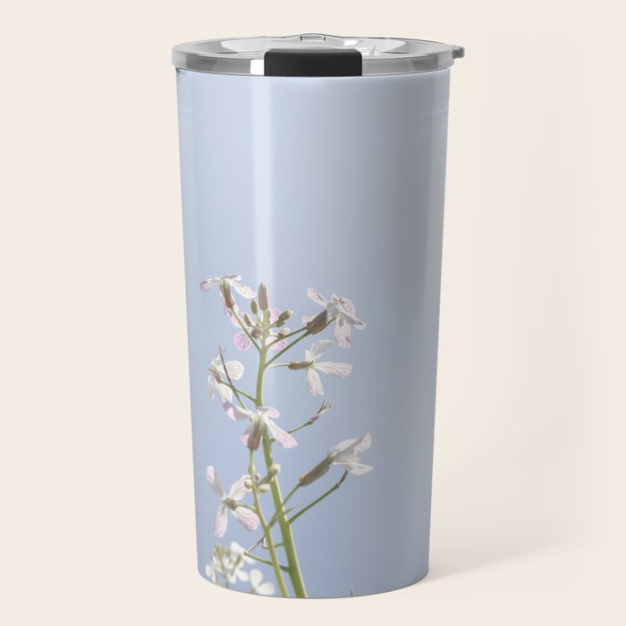 Wild radish flowers in a meadow in the spring against a clear blue sky - nature photography Travel Mug Gallery Image 1