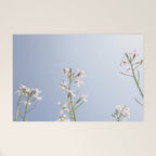 Wild radish flowers in a meadow in the spring against a clear blue sky - nature photography Welcome Mat Gallery Image 1