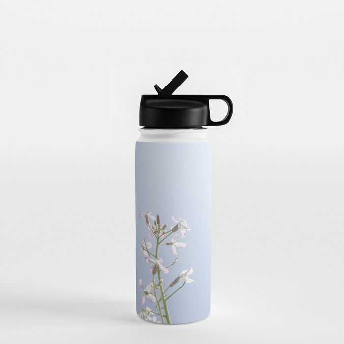 Wild radish flowers in a meadow in the spring against a clear blue sky - nature photography Water Bottle Gallery Image 1