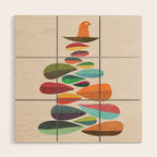 Bird nesting on top of pebbles hill Wood Wall Art Gallery Image 1