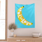Big fruit Banana with 'Peel the love' typographic pun Wall Tapestry Gallery Image 2
