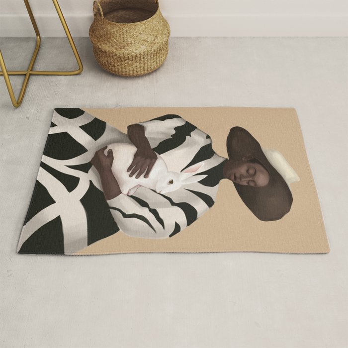 Woman in Stripes Holding a White Rabbit Rug Gallery Image 1