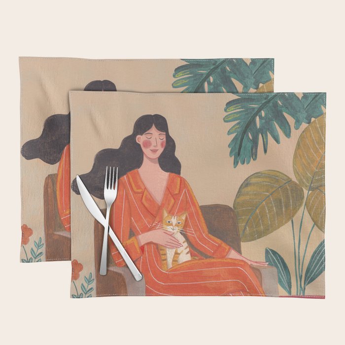 Woman with cat in living room in warm earth tones Placemat Gallery Image 1