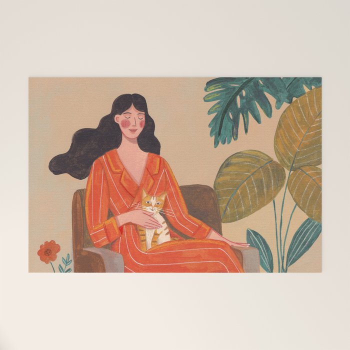 Woman with cat in living room in warm earth tones Welcome Mat Gallery Image 1