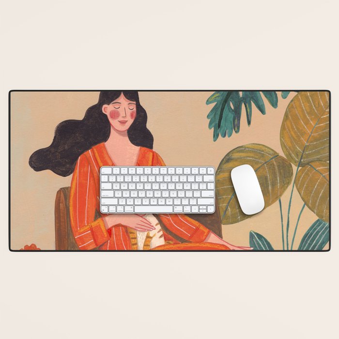 Woman with cat in living room in warm earth tones Desk Mat Gallery Image 1