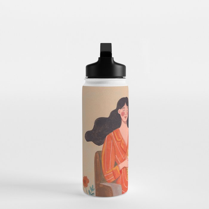 Woman with cat in living room in warm earth tones Water Bottle Gallery Image 3