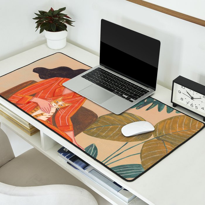 Woman with cat in living room in warm earth tones Desk Mat Gallery Image 2