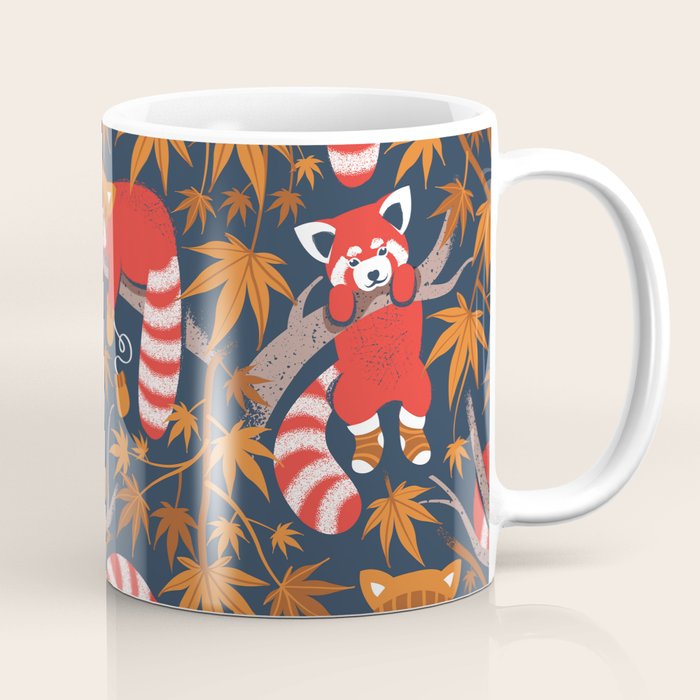 Red panda blending with the foliage // navy background red cozy animals fog brown taupe tree branches orange acer leaves Coffee Mug Gallery Image 1
