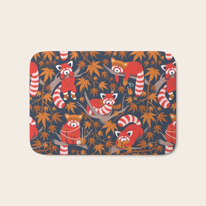 Red panda blending with the foliage // navy background red cozy animals fog brown taupe tree branches orange acer leaves Bath Mat Gallery Image 1