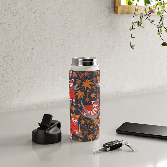 Red panda blending with the foliage // navy background red cozy animals fog brown taupe tree branches orange acer leaves Water Bottle Gallery Image 4