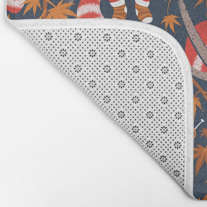 Red panda blending with the foliage // navy background red cozy animals fog brown taupe tree branches orange acer leaves Bath Mat Gallery Image 2