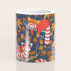 Red panda blending with the foliage // navy background red cozy animals fog brown taupe tree branches orange acer leaves Coffee Mug Gallery Image 4