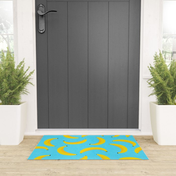 Minimal bold and vibrant banana pattern yellow on blue Welcome Mat Gallery Image 3