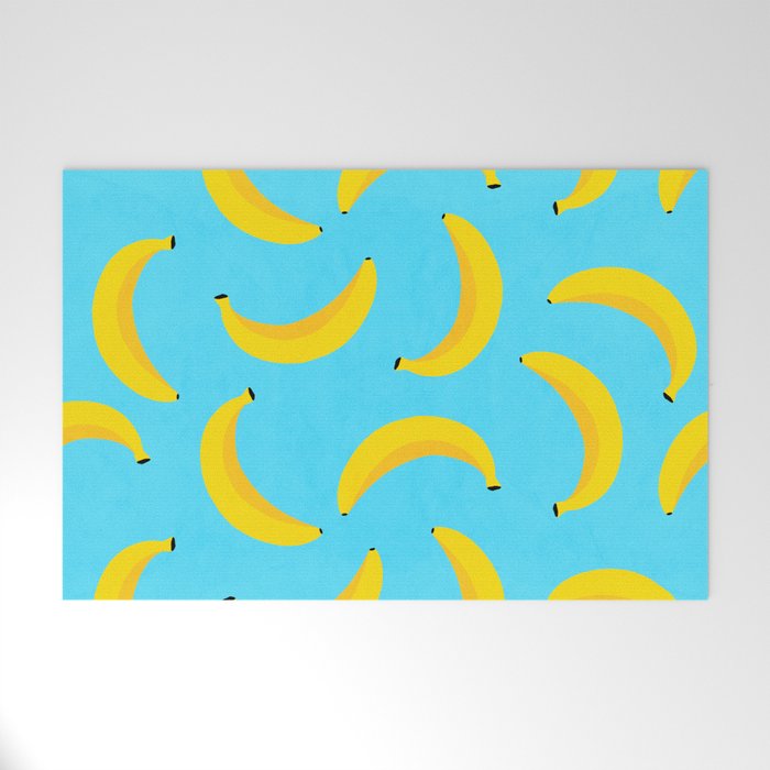 Minimal bold and vibrant banana pattern yellow on blue Welcome Mat Gallery Image 1