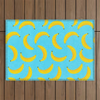 Minimal bold and vibrant banana pattern yellow on blue Outdoor Rug Gallery Image 1