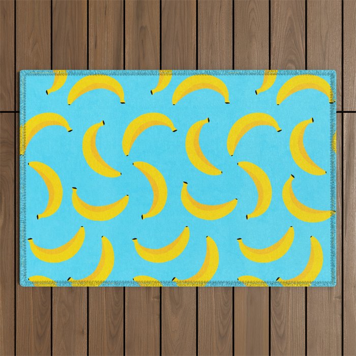 Minimal bold and vibrant banana pattern yellow on blue Outdoor Rug Gallery Image 1