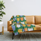 Rows of Tulips in Bloom in Forest Green & Orange Throw Blanket Gallery Image 1