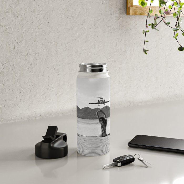 Steady as she goes girl in bikini on a dock with plane landing black and white photograph Water Bottle Gallery Image 4