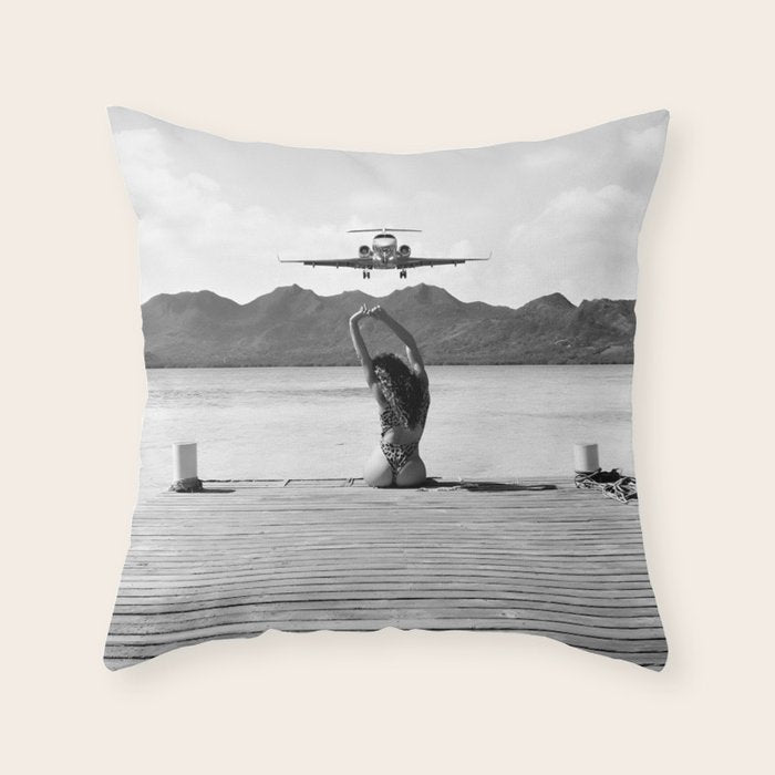 Steady as she goes girl in bikini on a dock with plane landing black and white photograph Throw Pillow Gallery Image 1