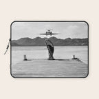 Steady as she goes girl in bikini on a dock with plane landing black and white photograph Laptop Sleeve Gallery Image 1