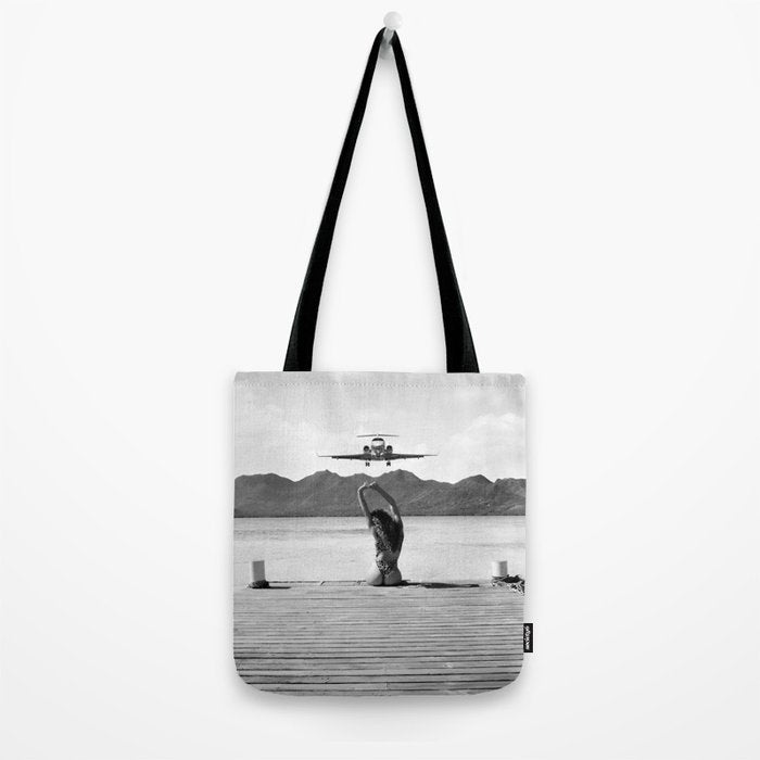 Steady as she goes girl in bikini on a dock with plane landing black and white photograph Tote Bag Gallery Image 2