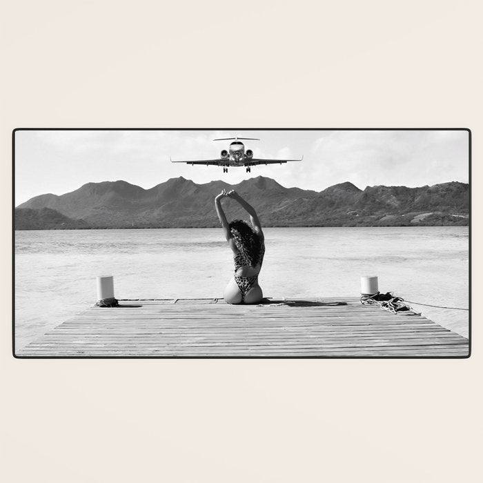 Steady as she goes girl in bikini on a dock with plane landing black and white photograph Desk Mat Gallery Image 3