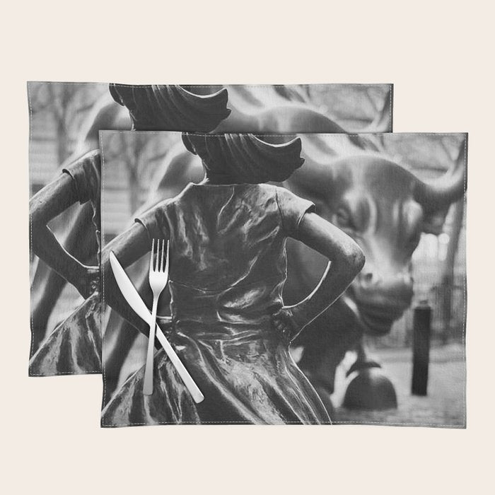 Fearless Girl facing down the Charging Bull statue of Wall Street black and white photography Placemat Gallery Image 1