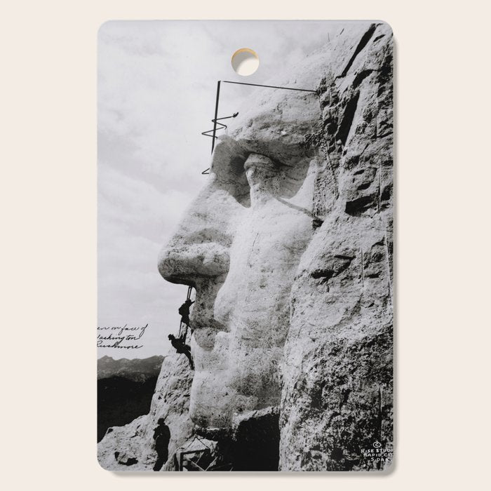 Workmen on face of George Washington, Mount Rushmore, South Dakota black and white photograph Cutting Board Gallery Image 1