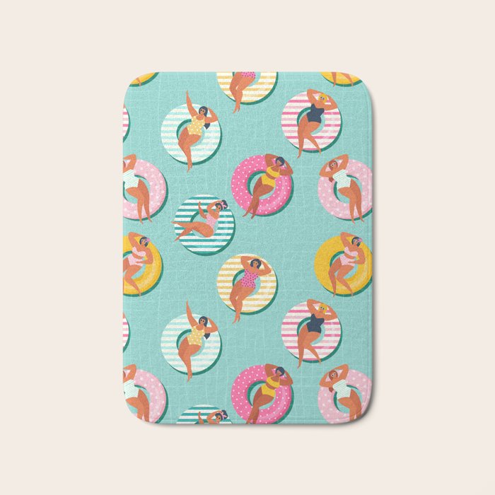 Summer gils on inflatable in swimming pool floats. Bath Mat Gallery Image 1