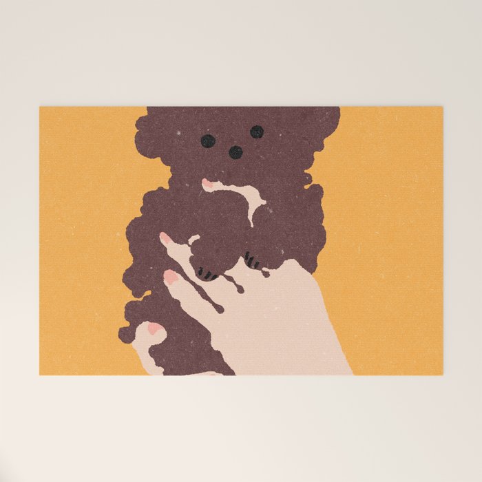 Cute puppy in arms Welcome Mat