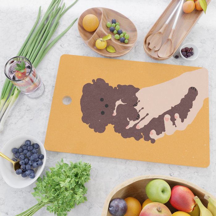 Cute puppy in arms Cutting Board Gallery Image 2