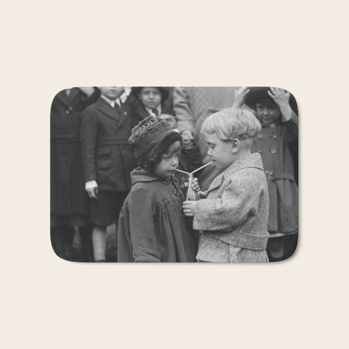 Sweet little boy and girl sharing a drink vintage funny humorous black and white photograph Bath Mat Gallery Image 1