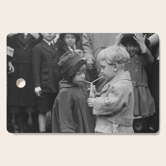 Sweet little boy and girl sharing a drink vintage funny humorous black and white photograph Cutting Board Gallery Image 1