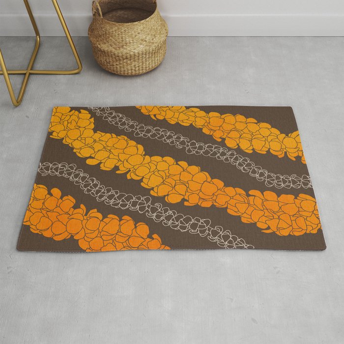 Hawaiian Puakenikeni lei on brown Rug Gallery Image 1