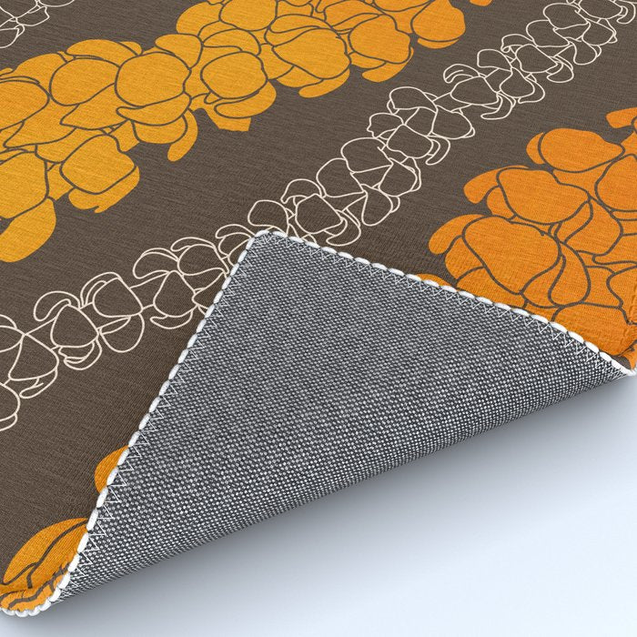 Hawaiian Puakenikeni lei on brown Rug Gallery Image 4