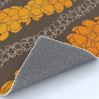 Hawaiian Puakenikeni lei on brown Rug Gallery Image 4