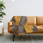 Hawaiian Puakenikeni lei on brown Throw Blanket Gallery Image 1