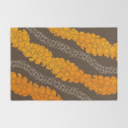Hawaiian Puakenikeni lei on brown Rug Gallery Image 2