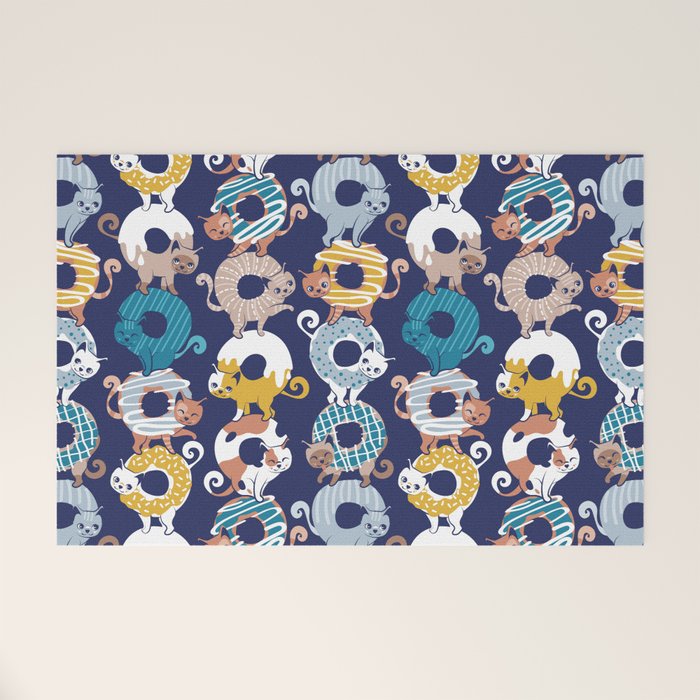 Cats Donut Care // blue background goldenrod yellow mustard, teal pastel blue and brown sweet kitties Welcome Mat Gallery Image 1