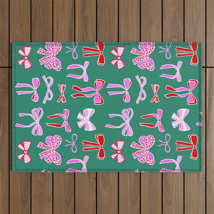 Festive Pink and Red Christmas Ribbons and Bows hand drawn Collection on Green Outdoor Rug Gallery Image 1