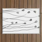 A group of poppy heads Outdoor Rug Gallery Image 1