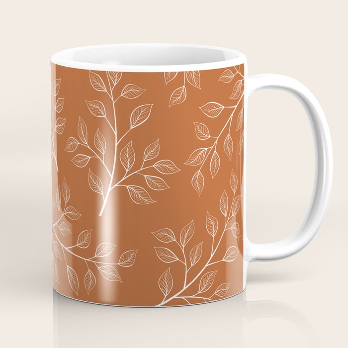 Delicate White Leaves and Branch on a Rust Orange Background Coffee Mug Gallery Image 1