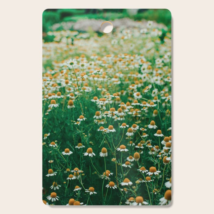 Little White Flowers in a Garden Cutting Board Gallery Image 1