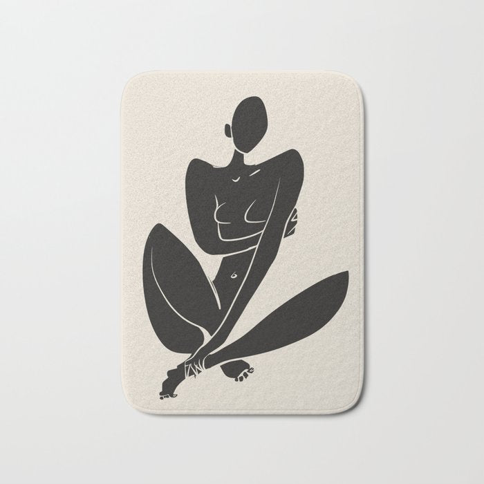 Sitting nude in black Bath Mat Gallery Image 1