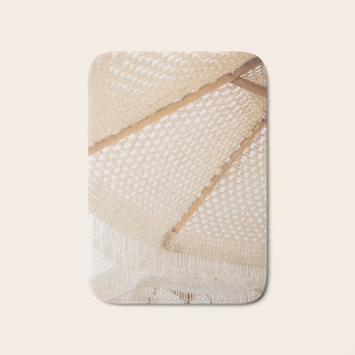 Boho crochet beach umbrella close-up, neutral minimalist summer photo Bath Mat Gallery Image 1