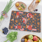 Red panda blending with the foliage // navy background red cozy animals fog brown taupe tree branches orange acer leaves Cutting Board Gallery Image 2